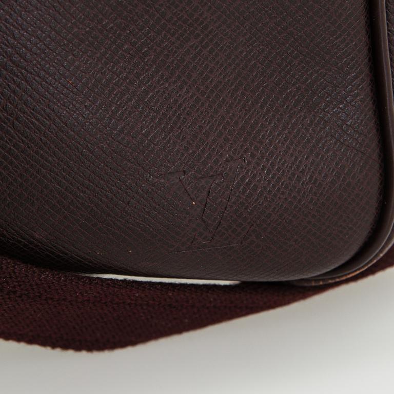 Louis Vuitton, a 'Taiga Kendall PM' weekend bag.
