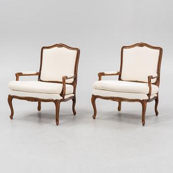 A pair of Rococo style armchairs, later part of the 20th century.