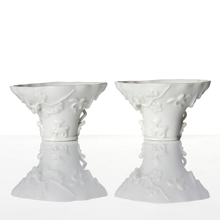 Two blanc de chine rhinoceros libation cups, Qing dynasty, Kangxi (1662-1722).