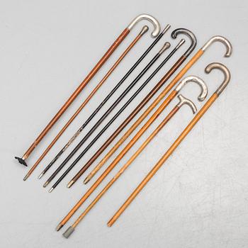 NINE WALKING STICKS, silver handles and a stick with plate handle, first half of the 20th century.