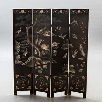 A Japanese 20th century lacquered folding screen.