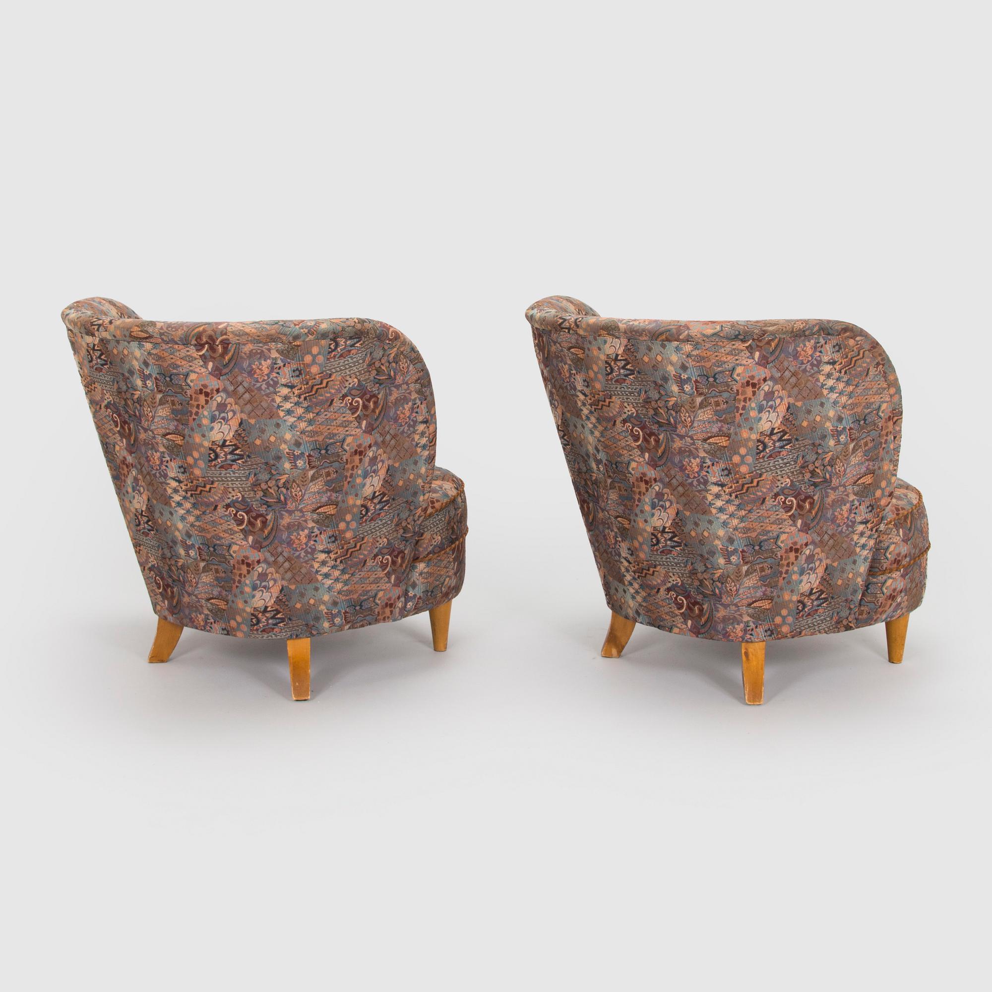 A pair of mid-20th century armchairs.