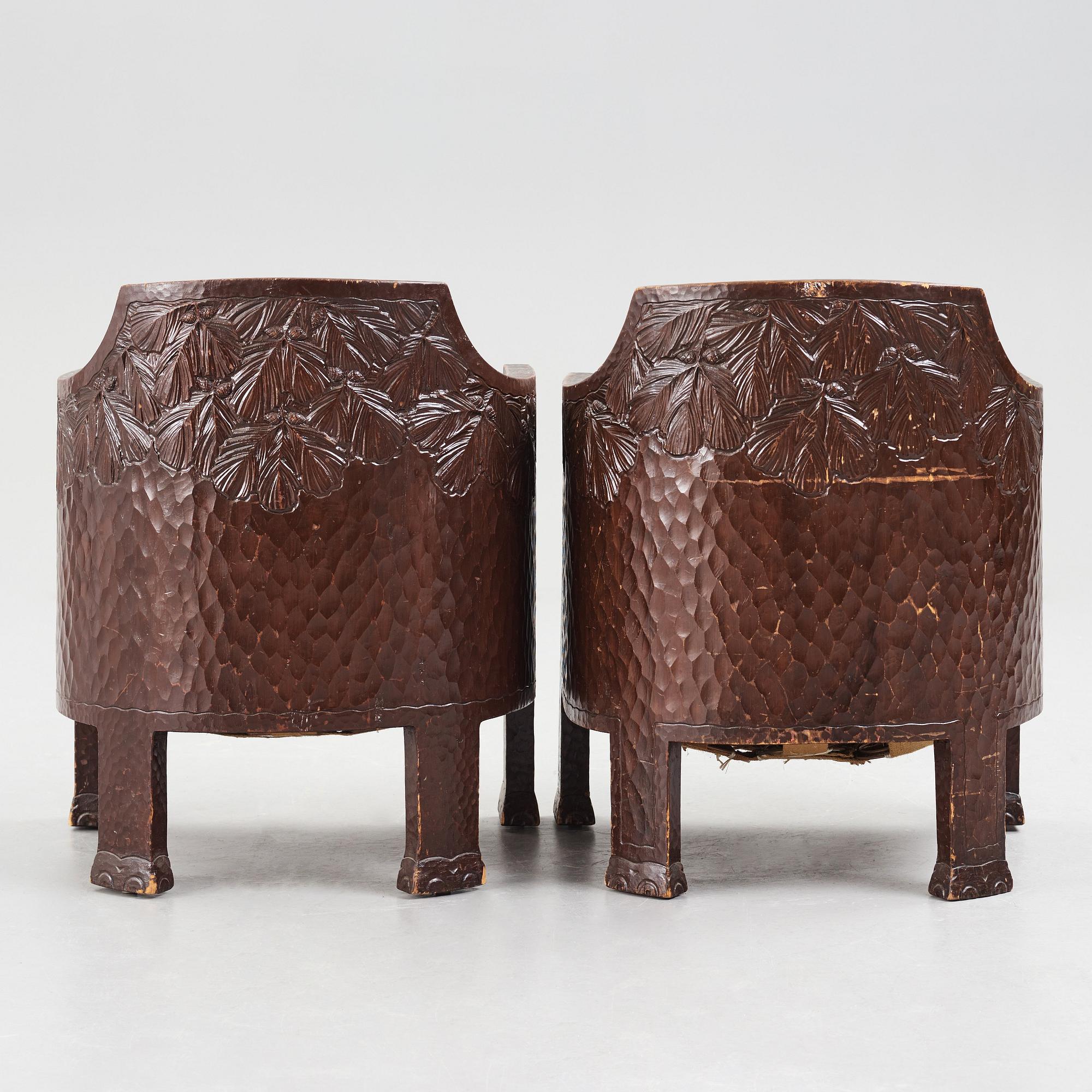 Otto Wretling, attributed to, a pair of Art Nouveau carved pine easy chairs,
