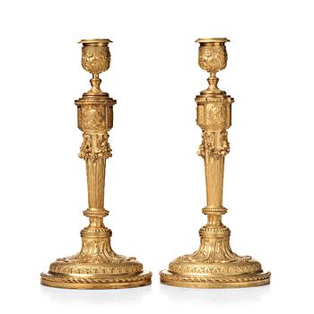 134. A pair of Louis XVI-style 19th century candlesticks by Raingo Frères, Paris.