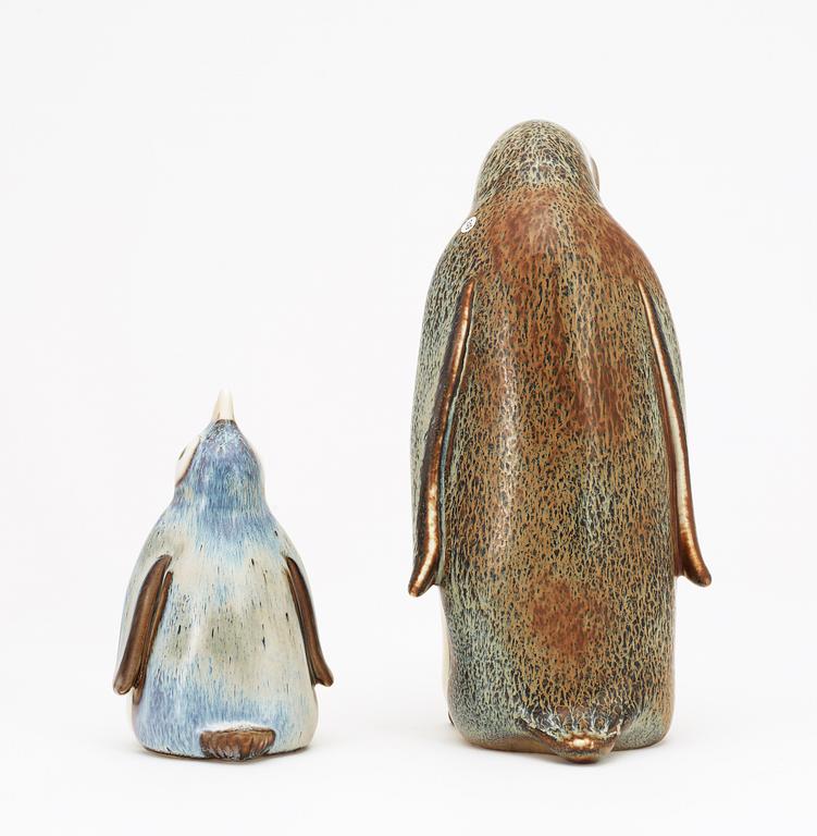 Two Gunnar Nylund stoneware figures depicting a penguin mother with child, Rörstrand.