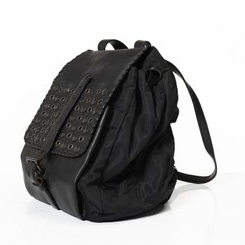 Prada, A nylon and leather backpack.