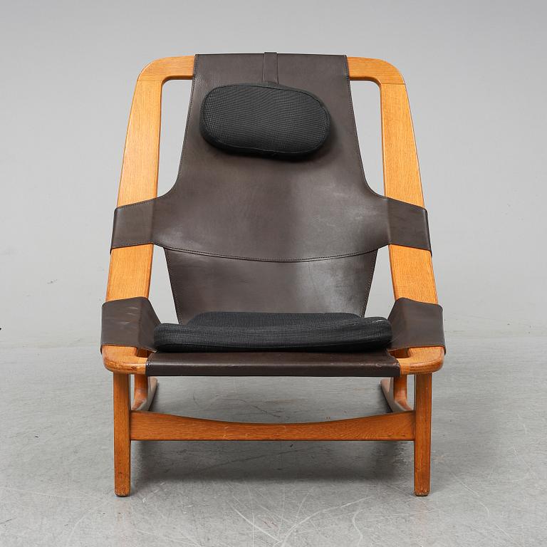 ARNE TIDEMAND RUUD, a teak and leather 'Holmenkollen'/'3030' easy chair, A/S Inventar, Gjövik, 1960's.