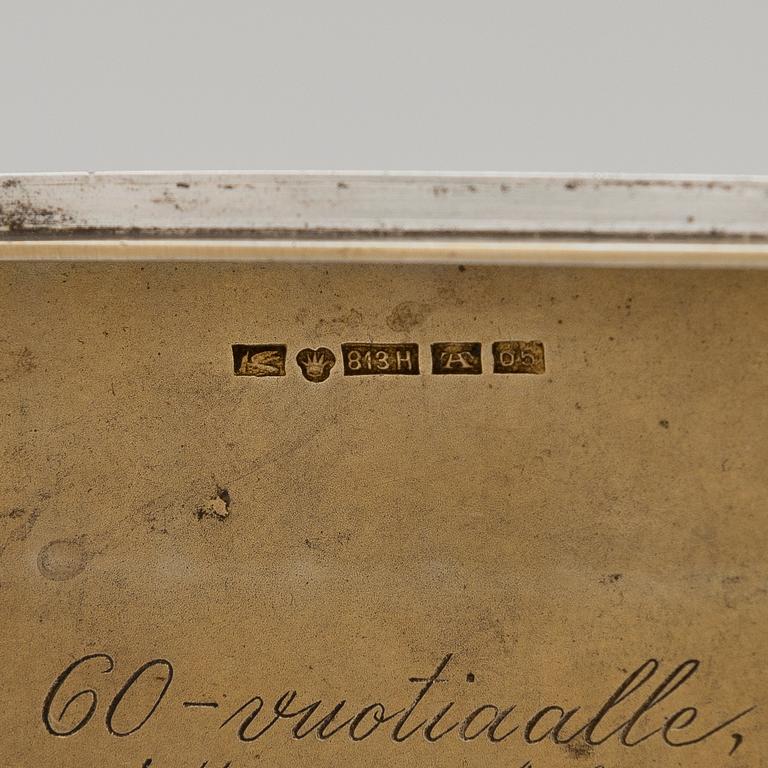 Three silver cigarette cases and a silver pillbox, marked in Finland and Germany, first half of the 20th Century.