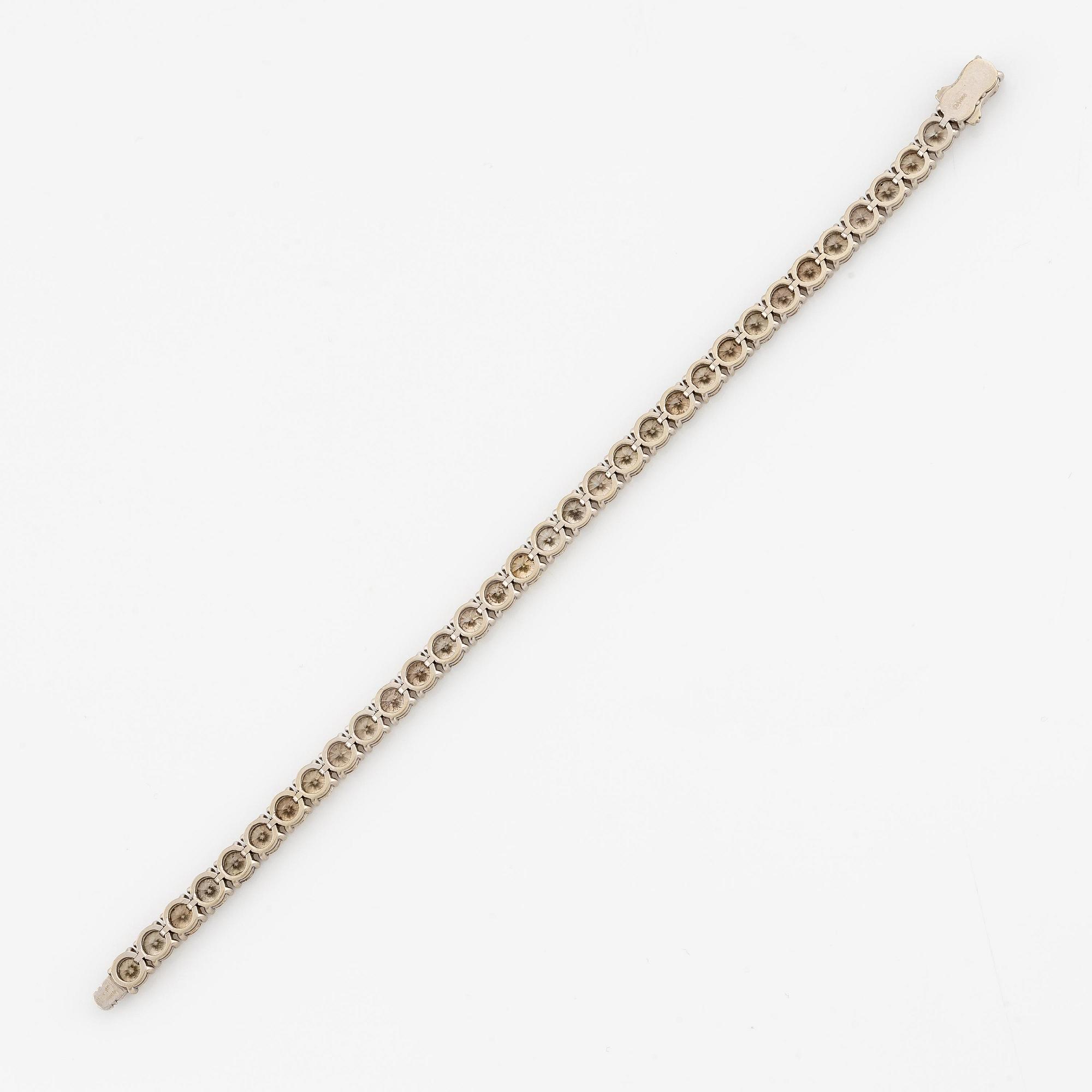 Armband 14K vitguld med runda briljantslipade diamanter.