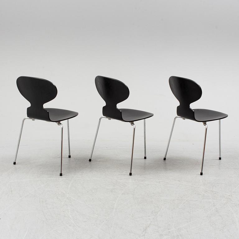 An Arne Jacobsen "Centenary Package" comprising three "Ant Chairs" and an eggshaped table, Fritz Hansen, Denmark.