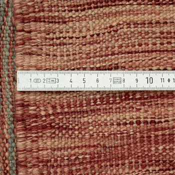 A kilim carpet, 304 x 203 cm.