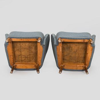 A pair of mid-20th century armchairs.