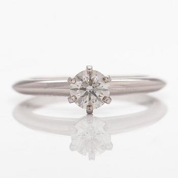 Tiffany & Co, a platinum ring with a brilliant-cut diamond.