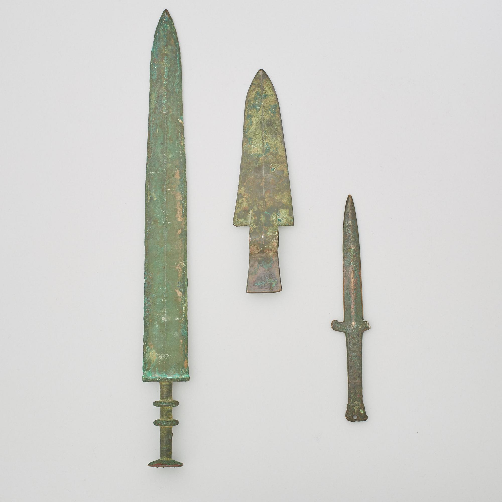 Two bronze daggers and a sword, preusmably Han dynasty (220 BC - 206 AD).