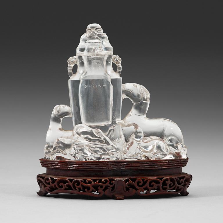 A rock crystal figural group with a vase and cover, presumably late Qing dynasty (1644-1912).