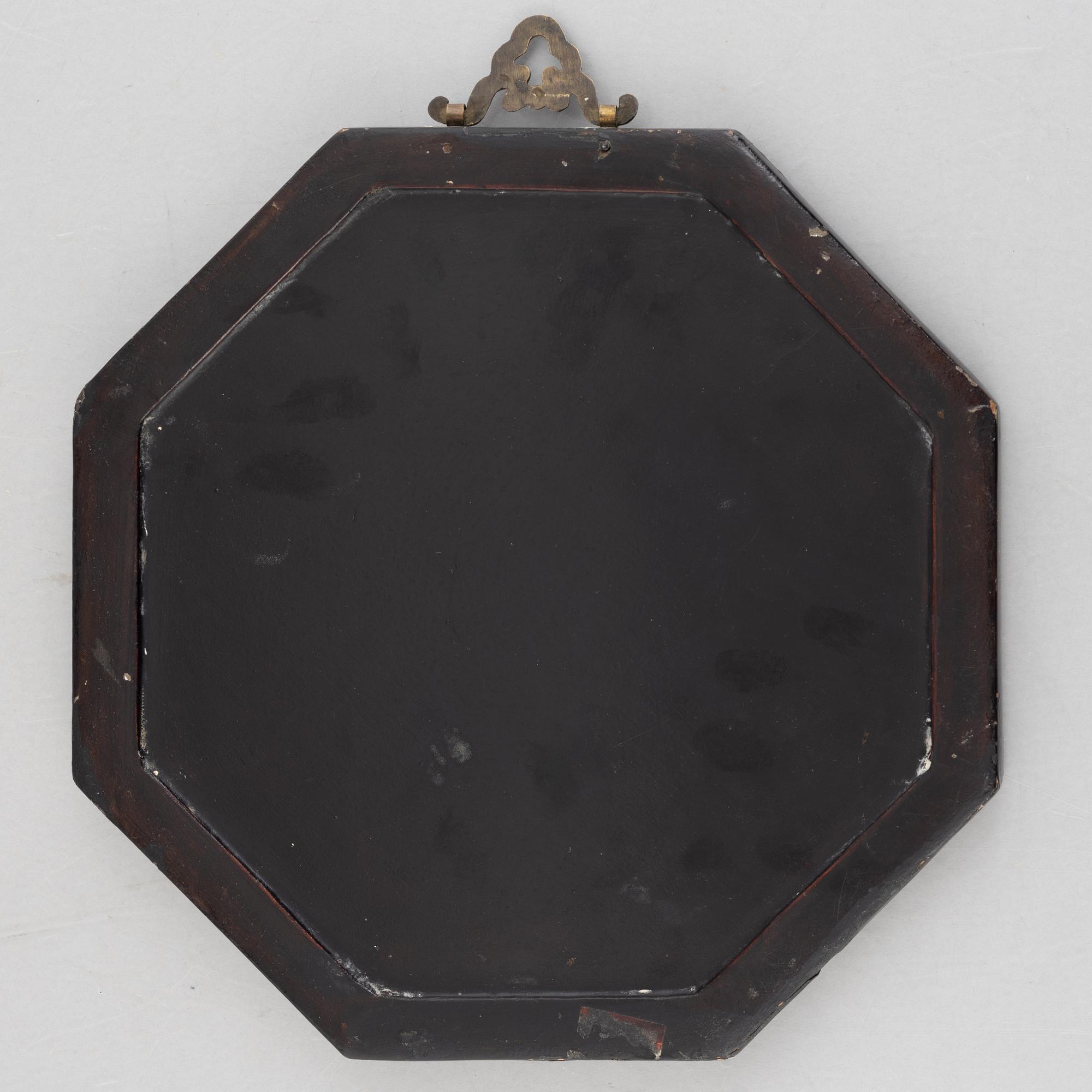 Four black-lacquered wall decorations, China, around 1900.