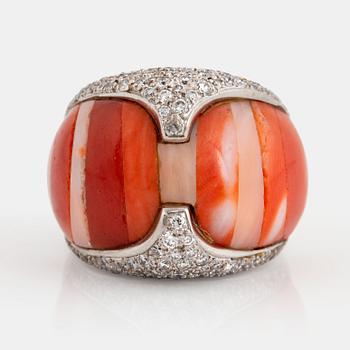 A Paul Binder ring in 18K white gold set with coral and round brillliant-cut diamonds.
