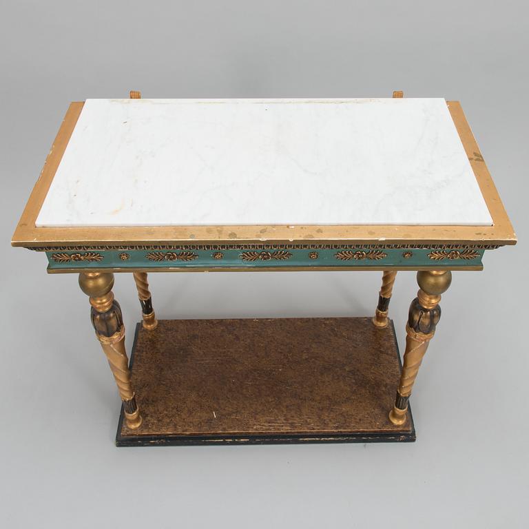 An early 20th century mirror with console table in late Gustavian style.