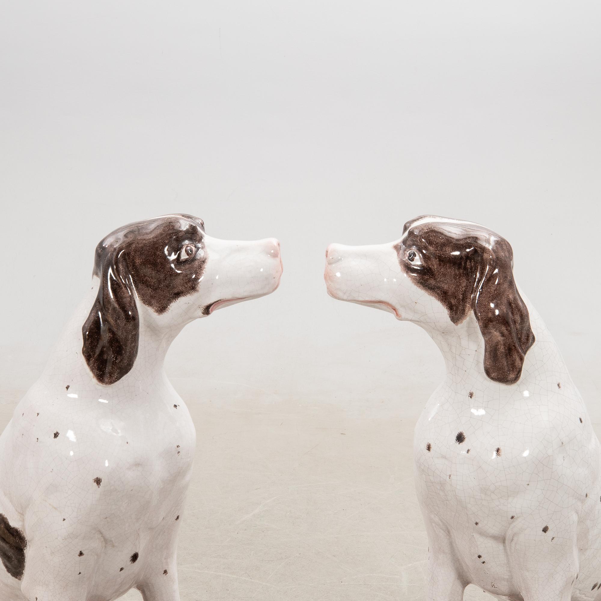 Decorative sculptures a pair England 20th century glazed ceramics.