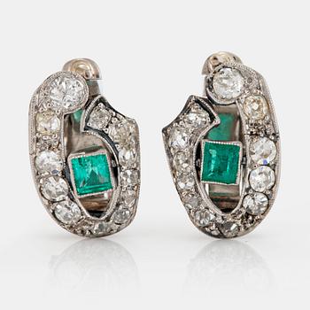 1037. A pair of 18K white gold earrings set with faceted emeralds and old- and eight-cut diamonds.