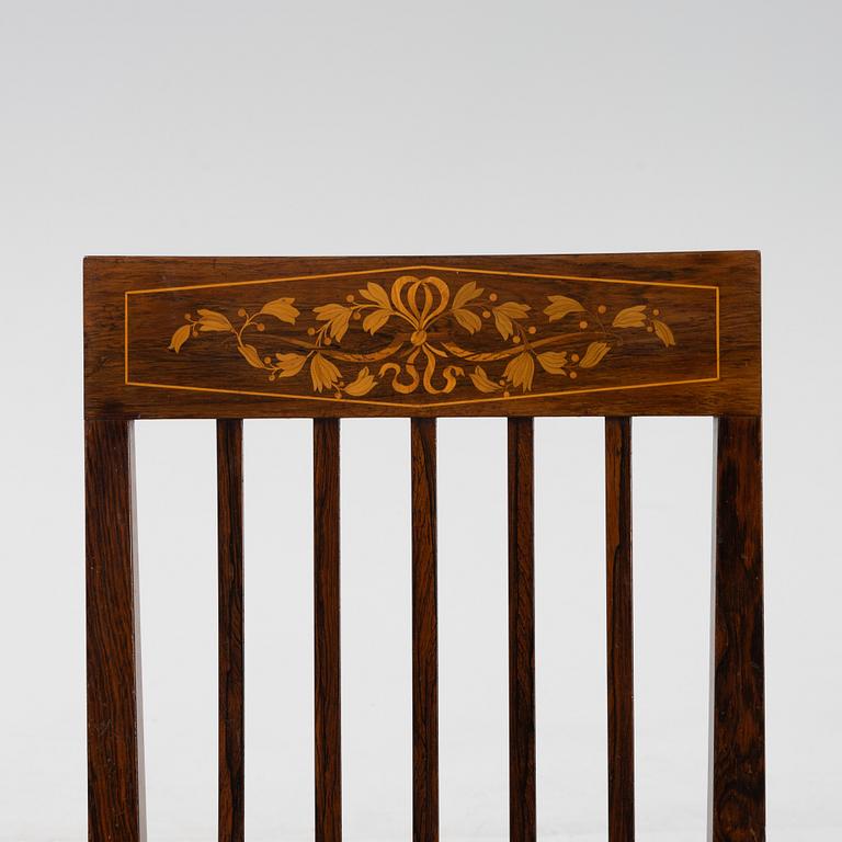 A group of five rosewood veneered chairs and a stool, mid 20th Century.