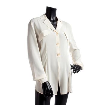 GIORGIO ARMANI, a light beige silk blouse.