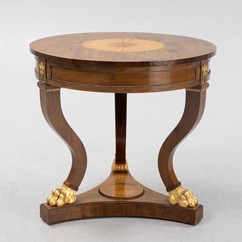 An empire style mahogany table, around 1900.