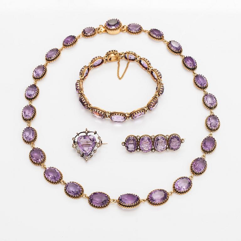 A necklace, bracelet and two brooches in gilded silver and with amethysts and pearls.