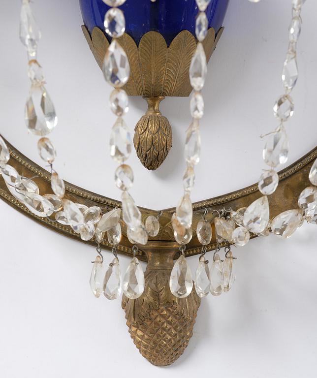 A pair of Russian Louis XVI-style  four-branch gilt bronze appliques, 19th century.