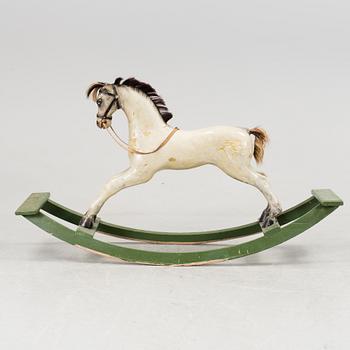 A painted rocking horse 19/20th century.