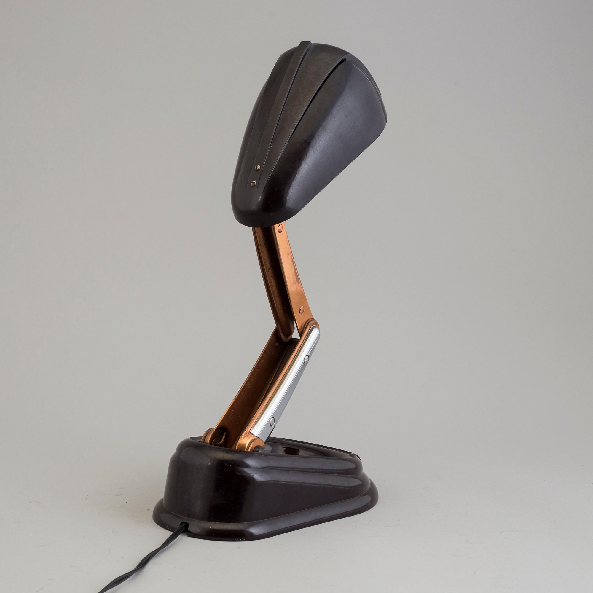 a bakelite and metal table 'Bolide' table lamp, by JUMO, 1940's.