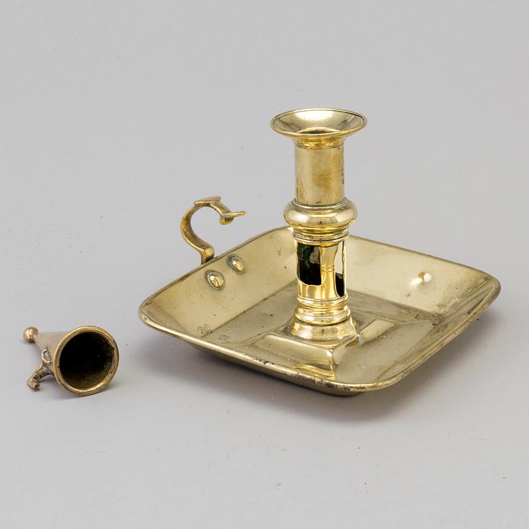 An 18th/19th century brass candlestick.