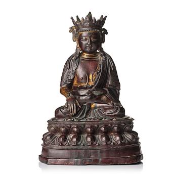 1244. A bronze sculpture of a crowned Buddha, presumably late Ming dynasty, with an inscription dating it as 1530.