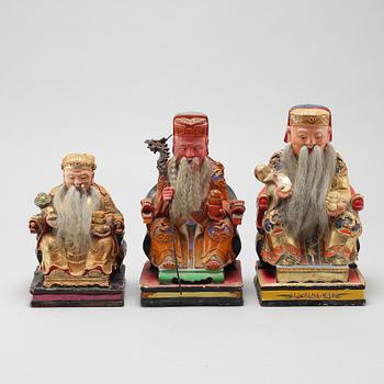 A set of three wooden deities, China, early 20th Century.