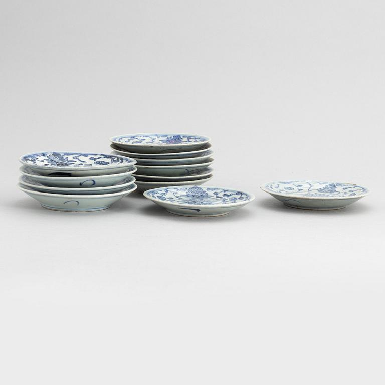 A set of 12 similar Chinese blue and white porcelain small dishes, late Qing dynasty, around the year 1900.