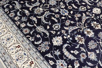 A carpet, Nain, part silk, ca 350 x 247 cm.