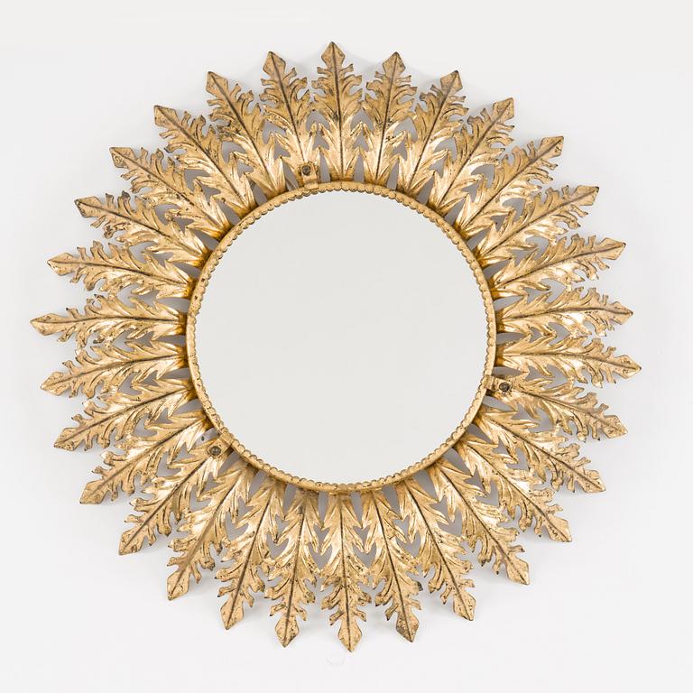 A mid 20th century metal sun mirror with lights.