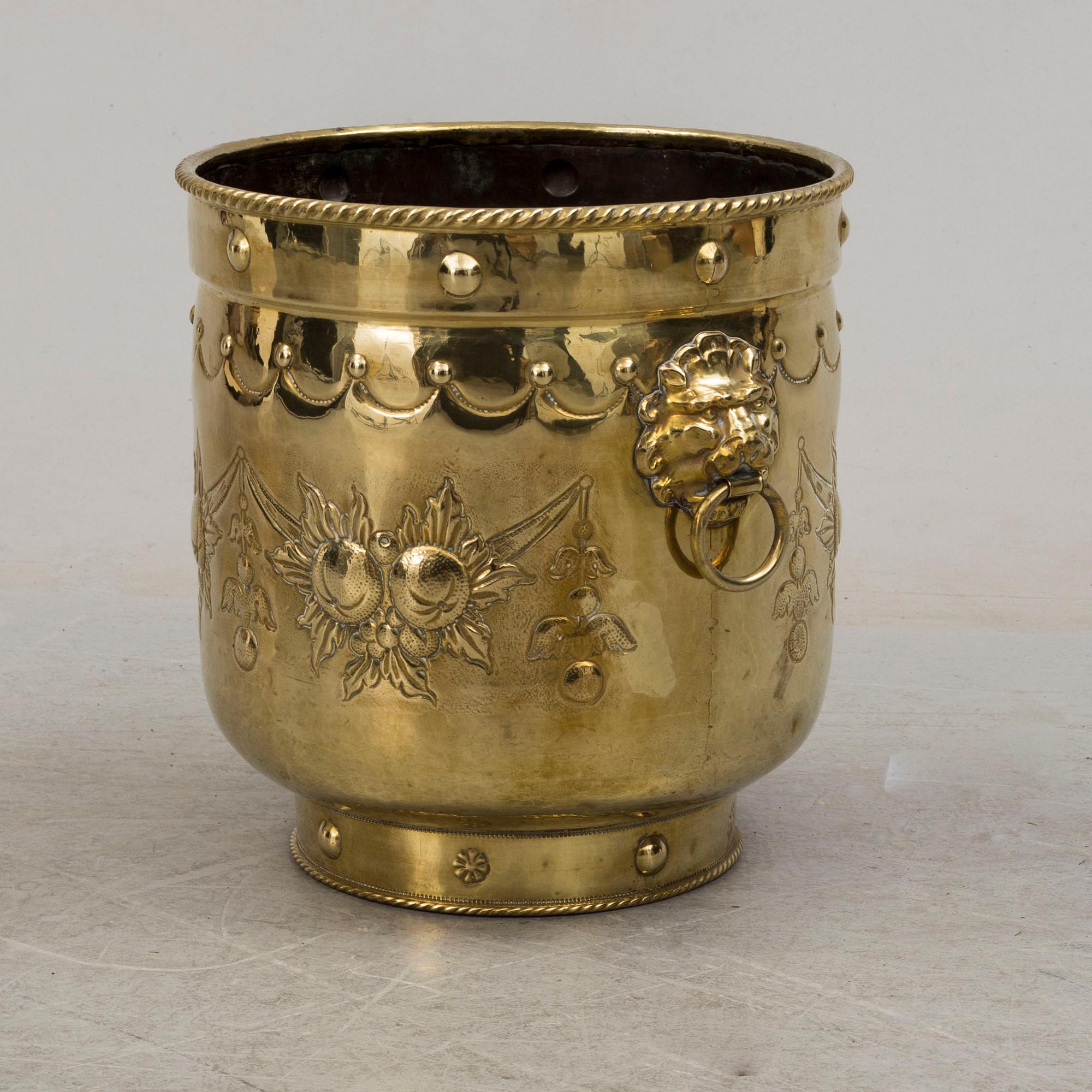 An 18th century brass flower pot.