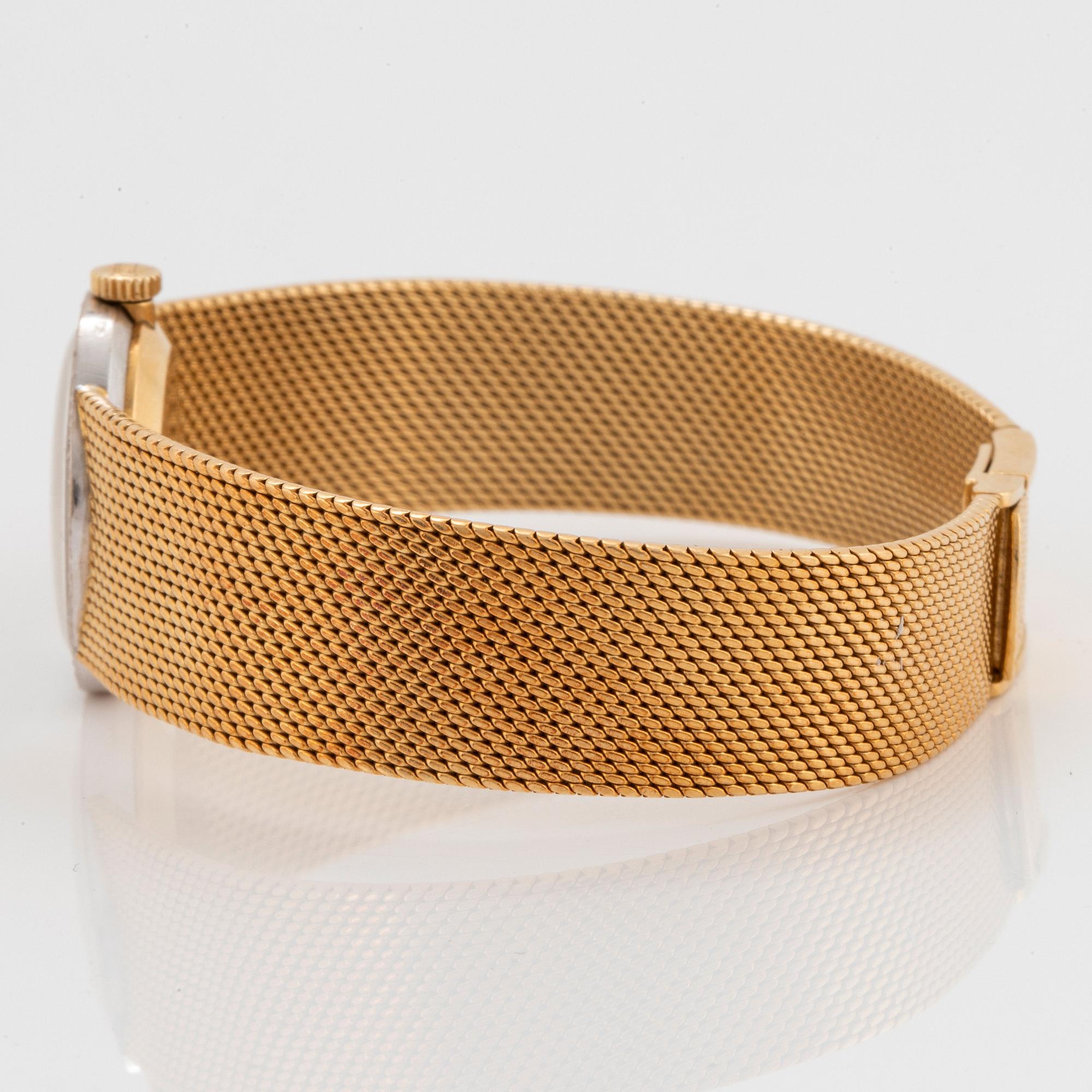 A Chopard wrist watch in 18K gold set with eight-cut diamonds.