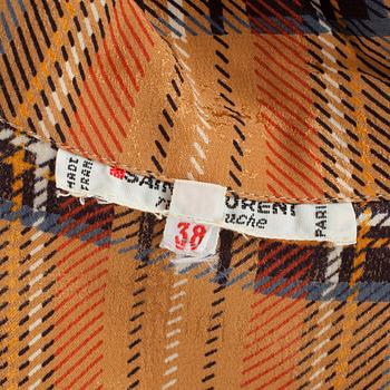 YVES SAINT LAURENT, a brown beige silk blouse.