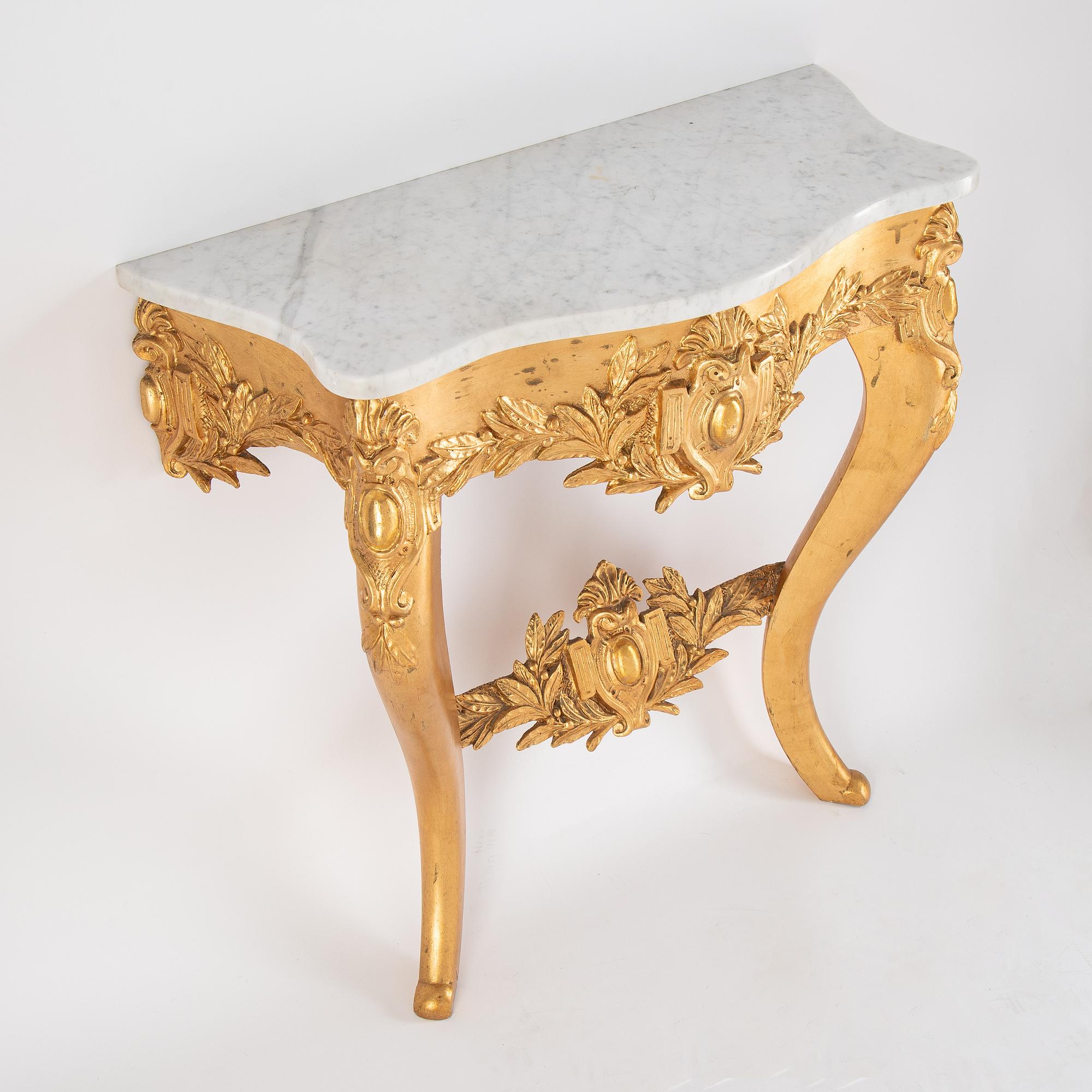 A mirror and console table from around the year 1900.