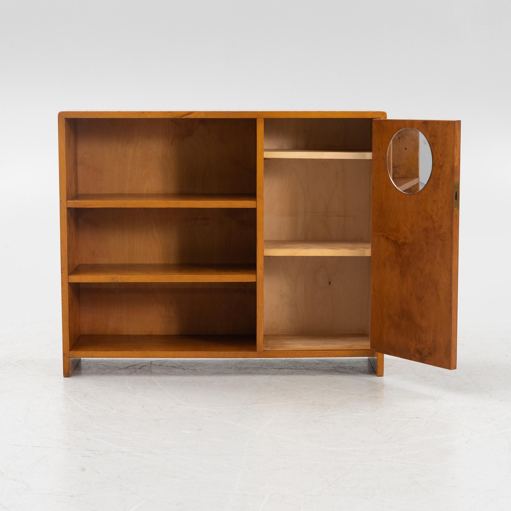 A birch wood book case with cabinet, 1930s.