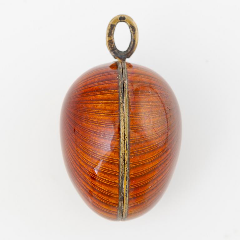 Pendant, in the form of an egg, A. Tillander, gilded silver and red enamel, Finland 1977.
