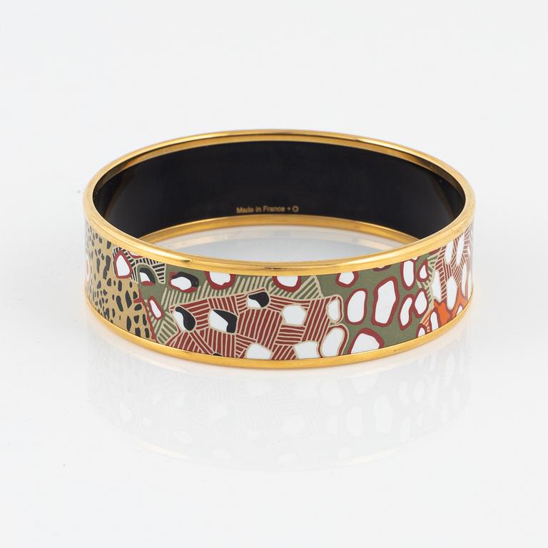 Hermès, an enamel and gold plated metal bangle.