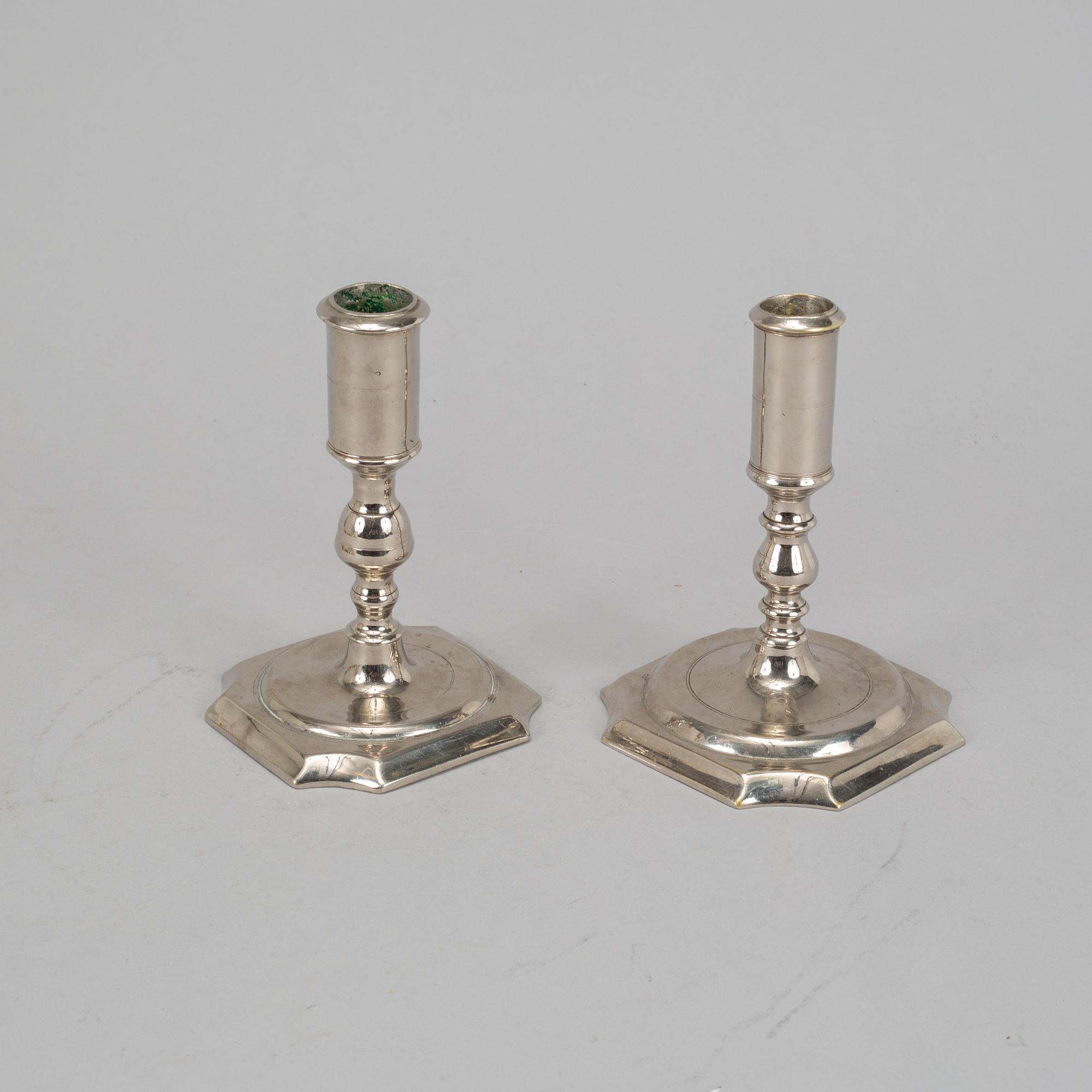 Two Swedish 18th century candlesticks.