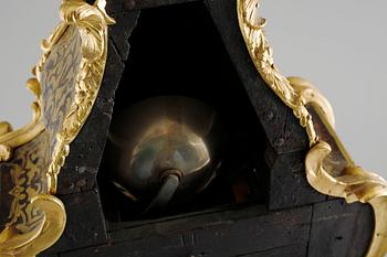 A 19th century mantle clock in the style of Louis XV.