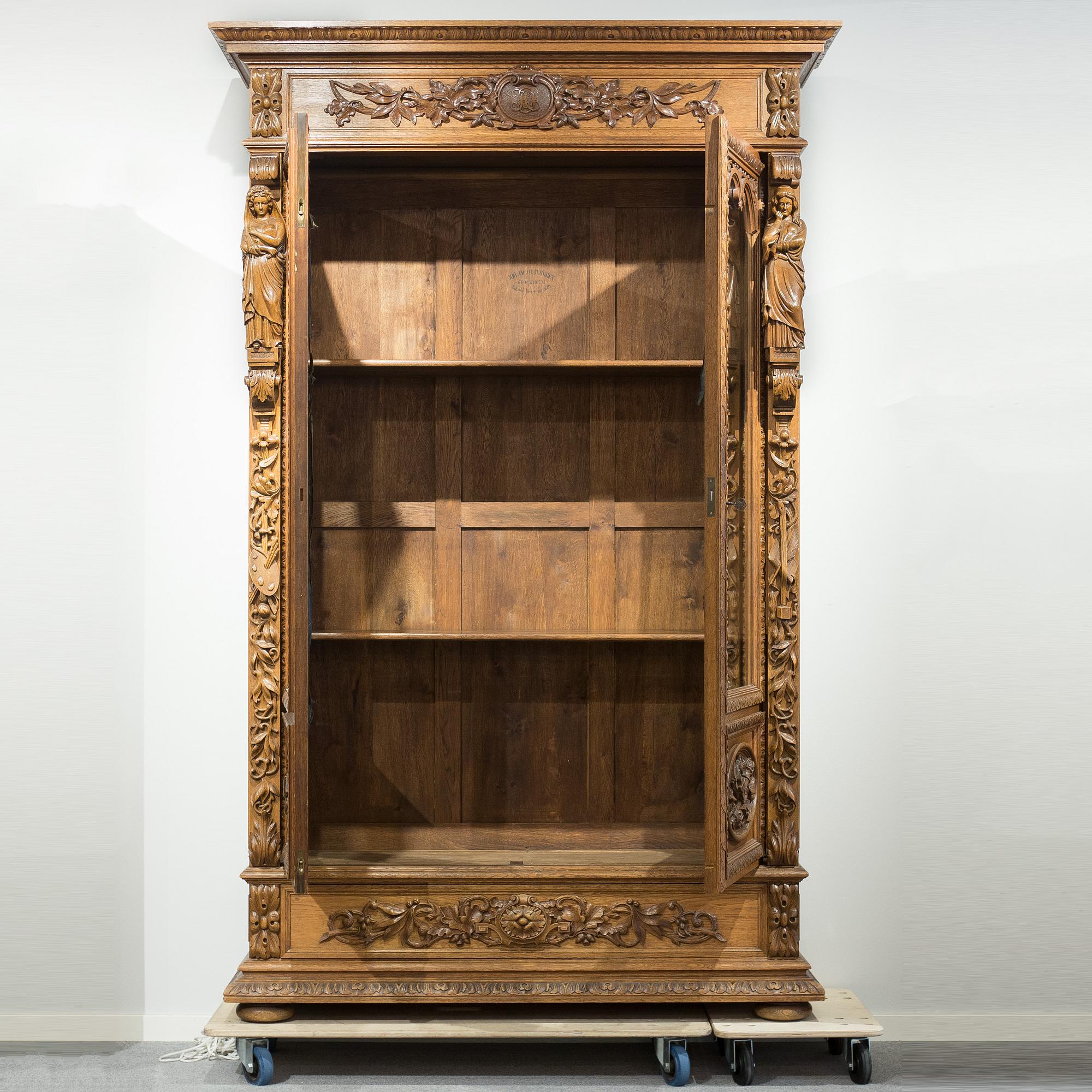 a oak vitrine cabinet from the late 1800's.