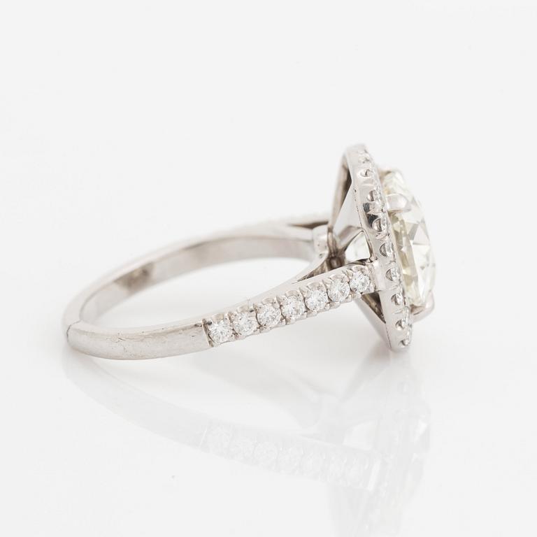 A platinum ring set with a cushion formed old-cut diamond 3.39 cts J vs1 according to accompanying HRD-certficate.