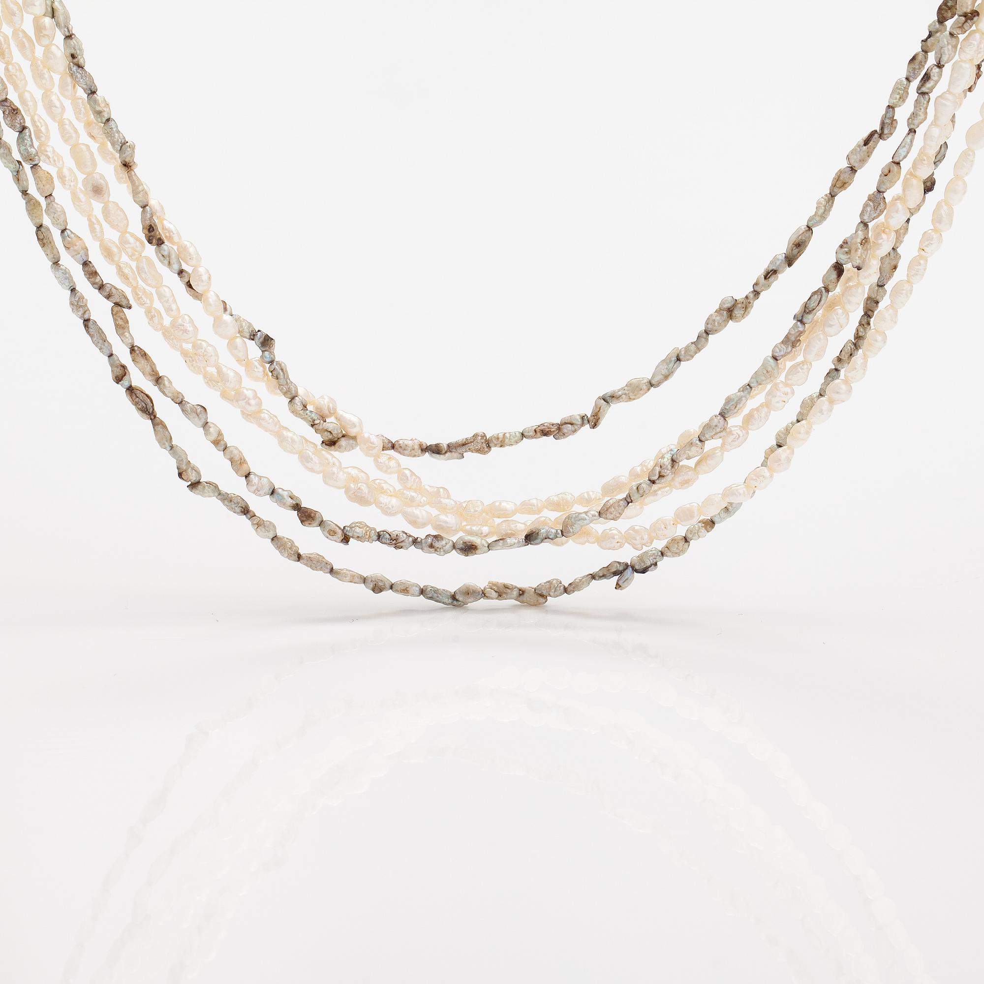 A six-strand pearlcollier with cultured pearls and a metal clasp.