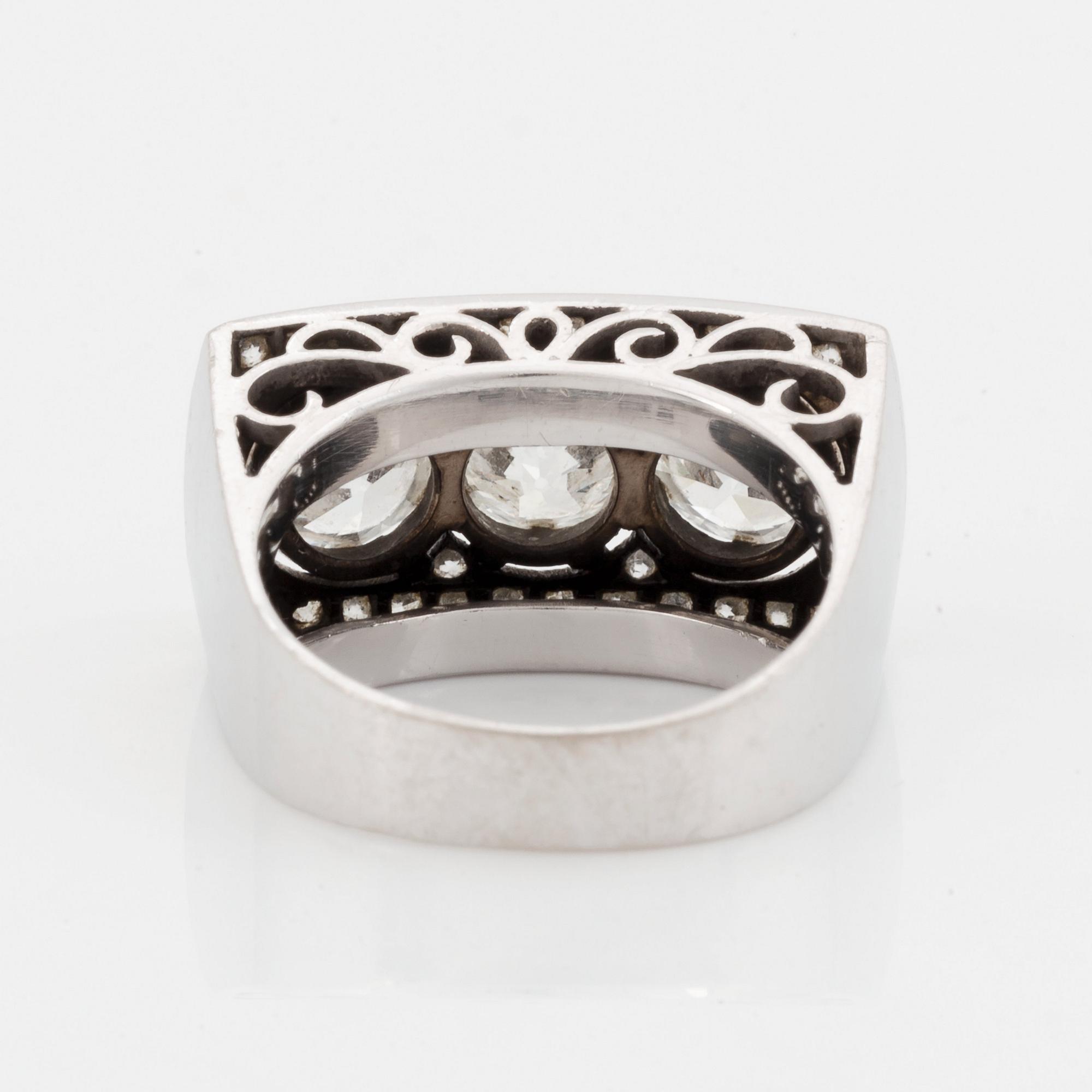 An 18K white gold ring set with old- and eight-cut diamonds.